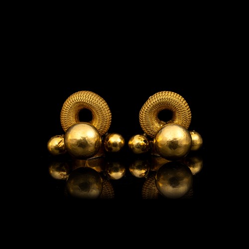 Thandatti and pampadam gold brooches.